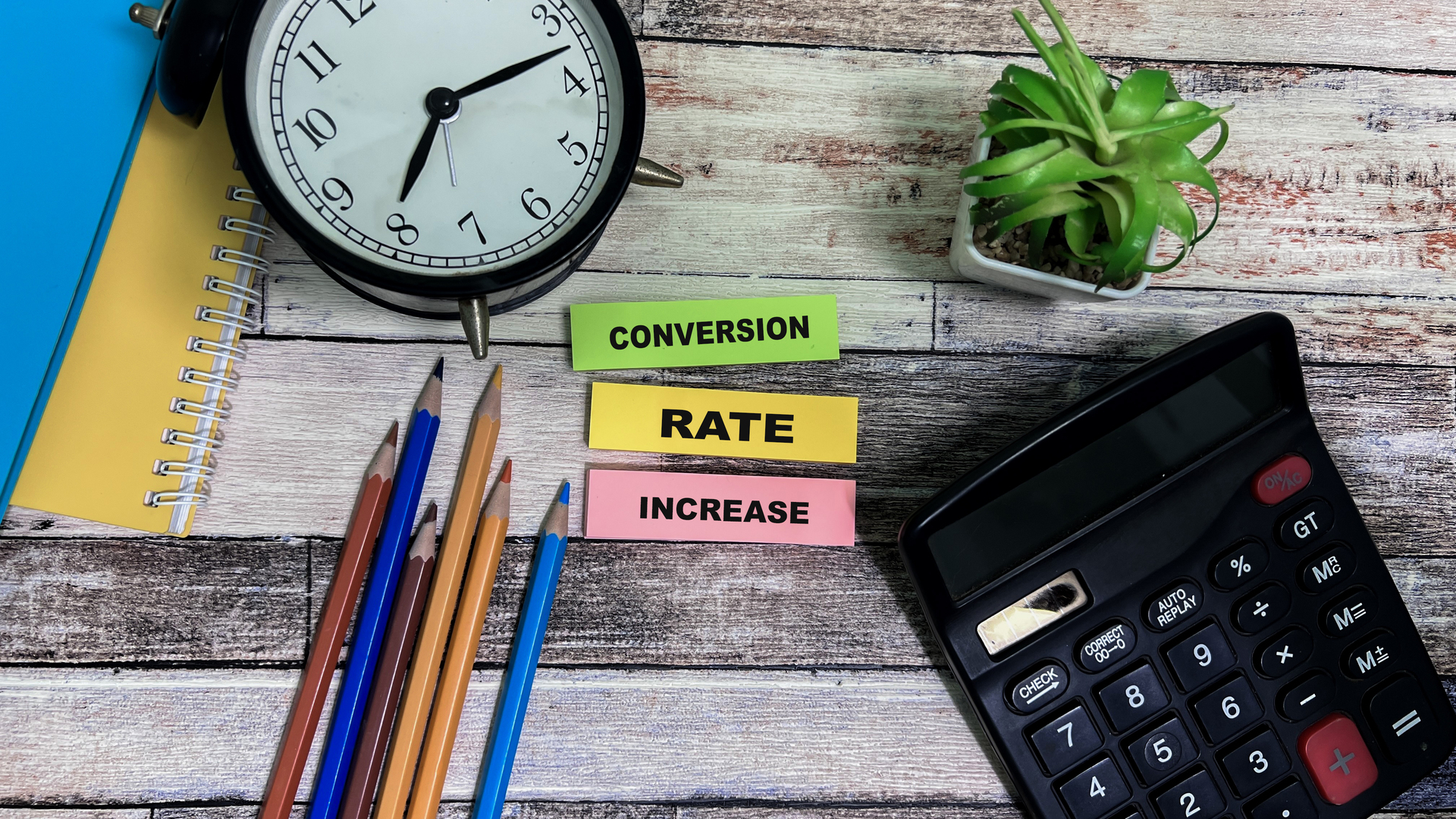 Concept of Conversion Rate Increase write on sticky notes isolated on Wooden Table.