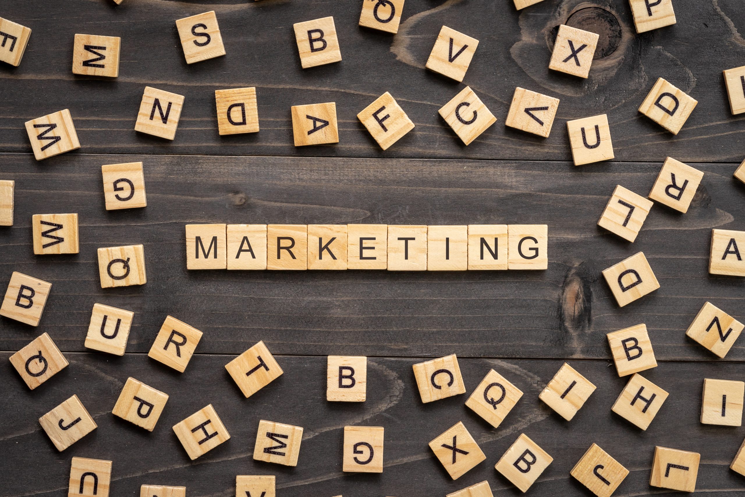 Marketing word wood block on table for business concept.